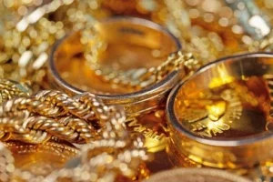 gold-jewelry-coins-bars-closeup-260nw-2256003925